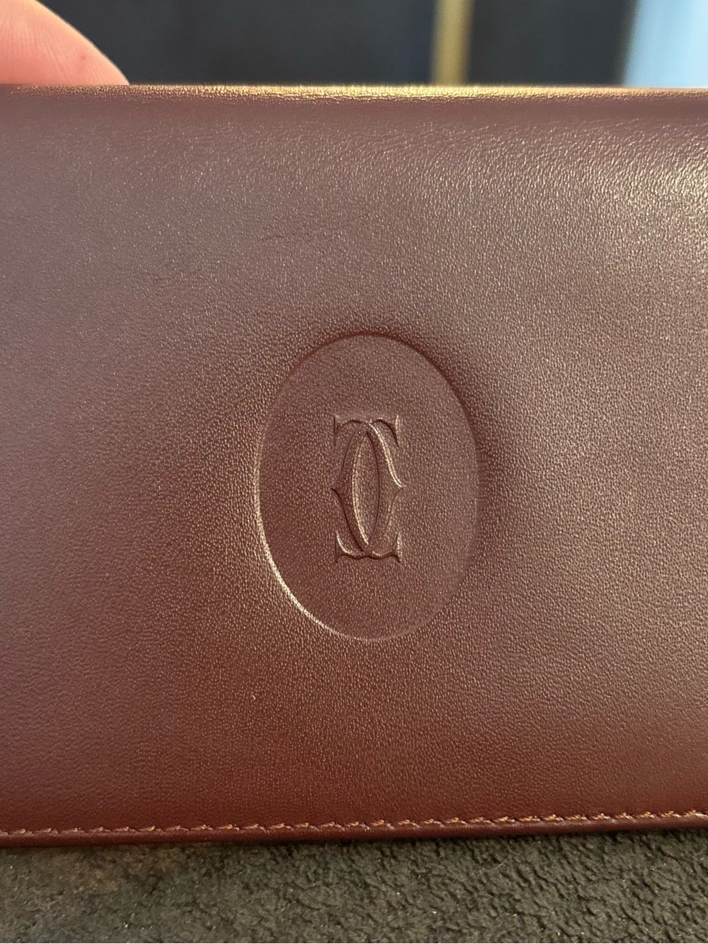 Cartier Gold Logo on Burgundy Leather
